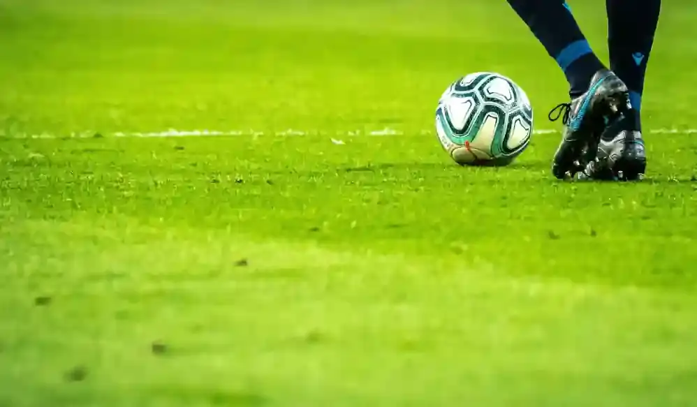 football player with ball in a football stadium